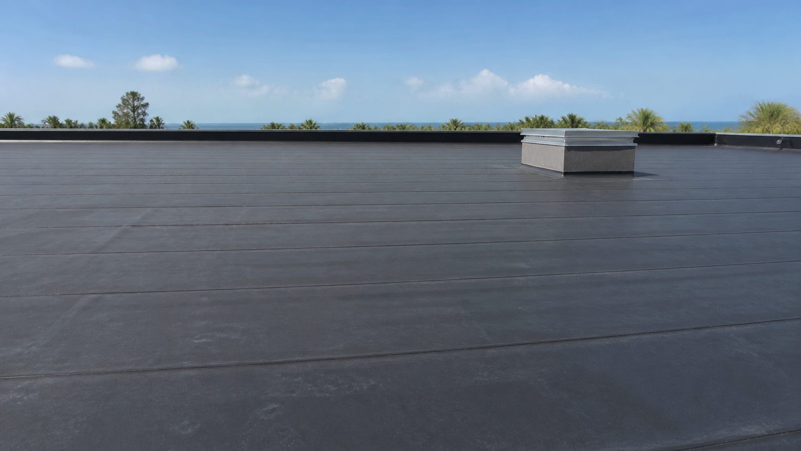 Wide black EPDM membrane roof with straight field laps in Florida